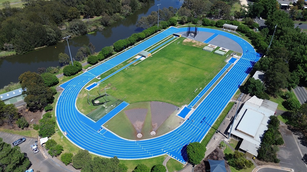 Aerial view of John Landy Athletics Field, with the existing blue athletics track and oval in the centre of the image and the Barwon River visible to the upper left of the image.