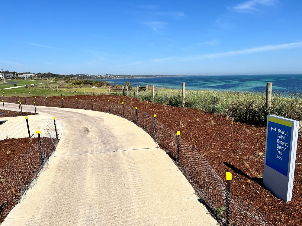 The Beacon Point Shared Trail featuring signage and views of the Bellarine Peninsula.